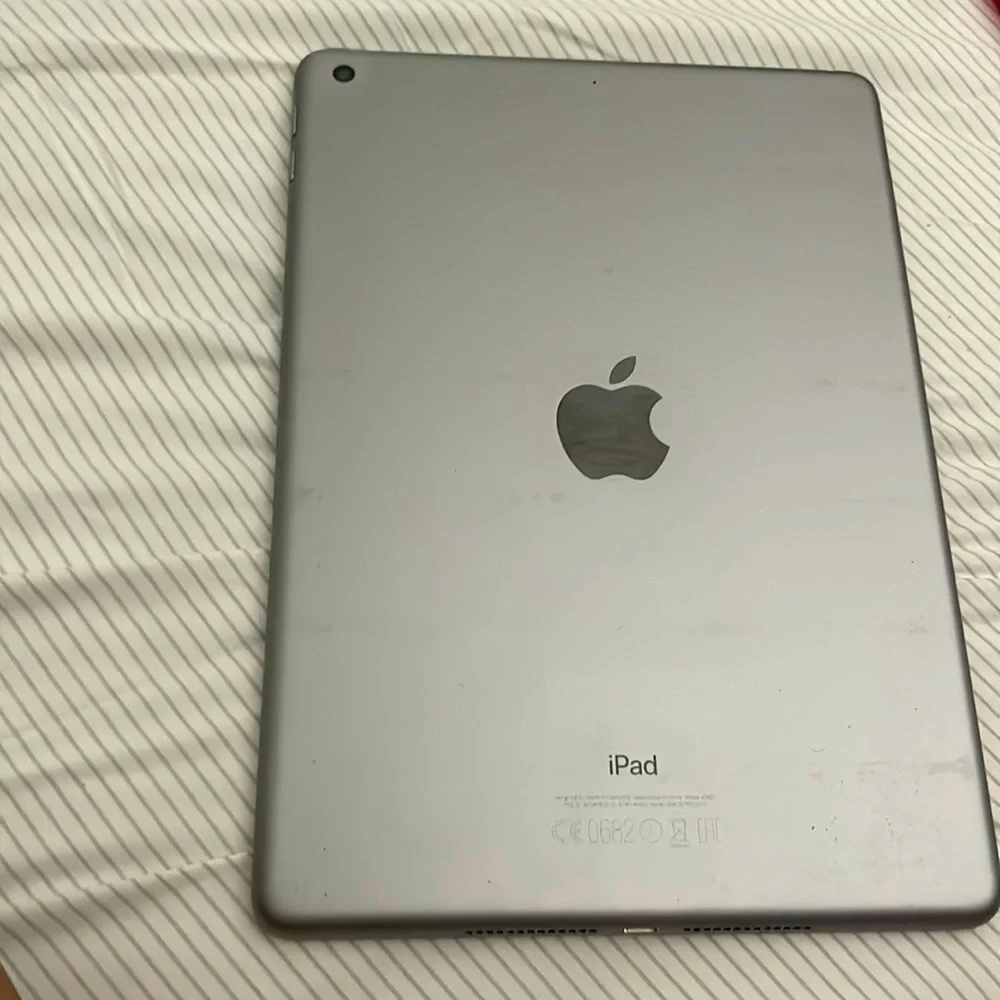 ipad 5th generation wifi but can be added to service slightly cracked screen
